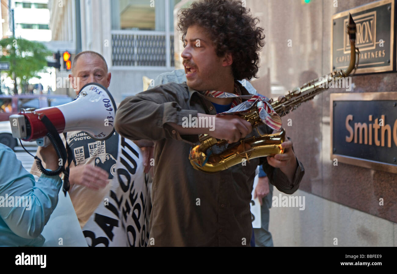 Conflict between musician and demonstrator Stock Photo