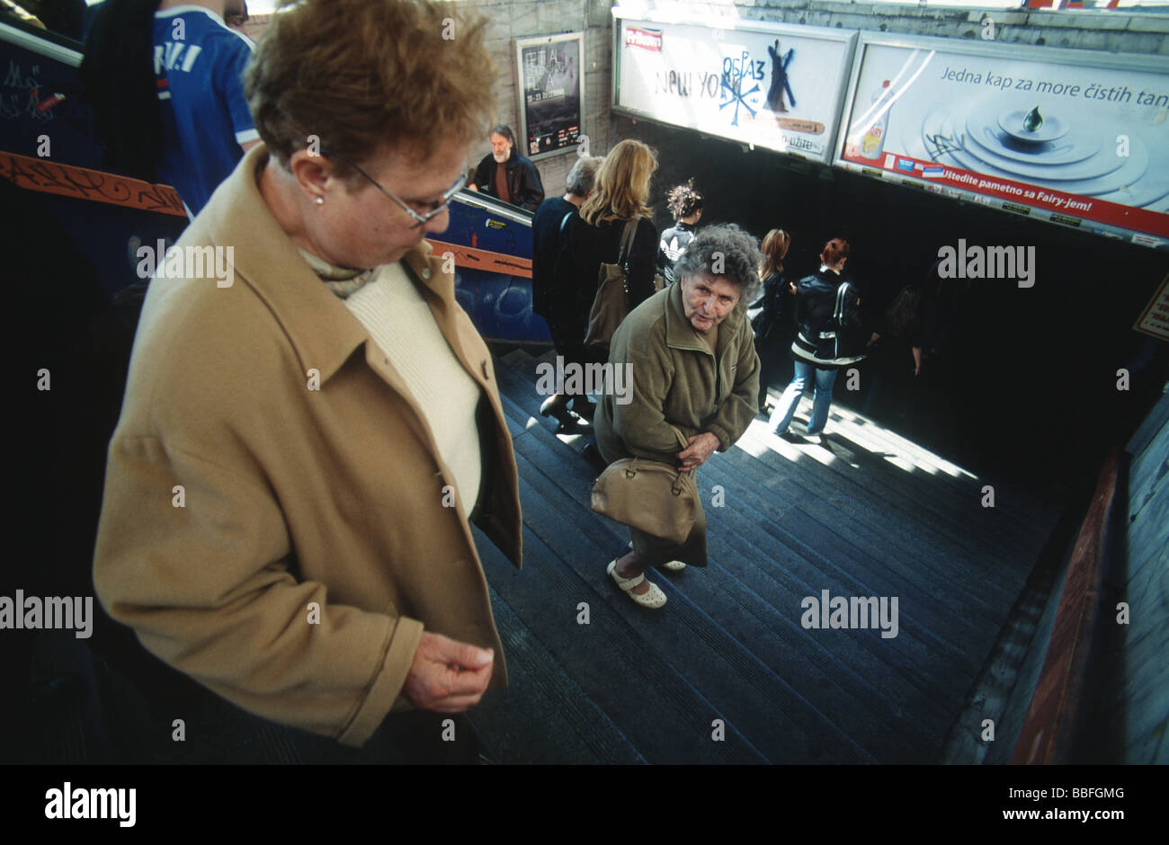 Two women descend downstairs in an undercrossing, Belgrade downtown, Serbia, Balkans Stock Photo