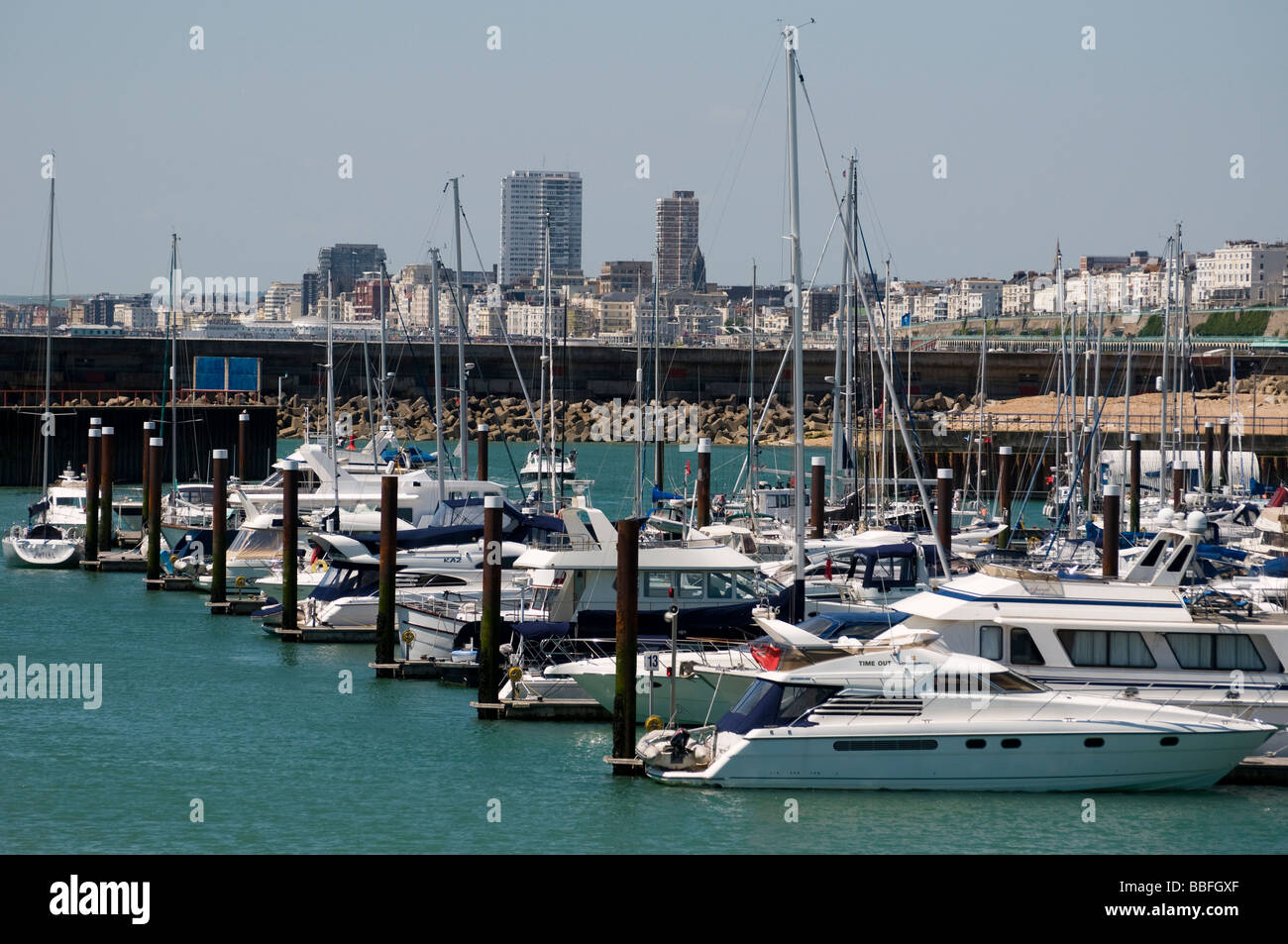 Yachts in Brigfhton Marina, with the Brighton skyline in the background. Stock Photo