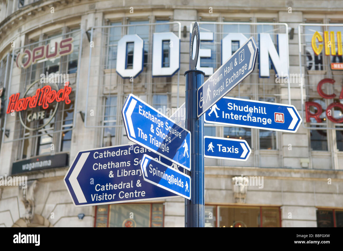 Street direction sign and Printworks entertainment  complex Manchester City Centre Stock Photo