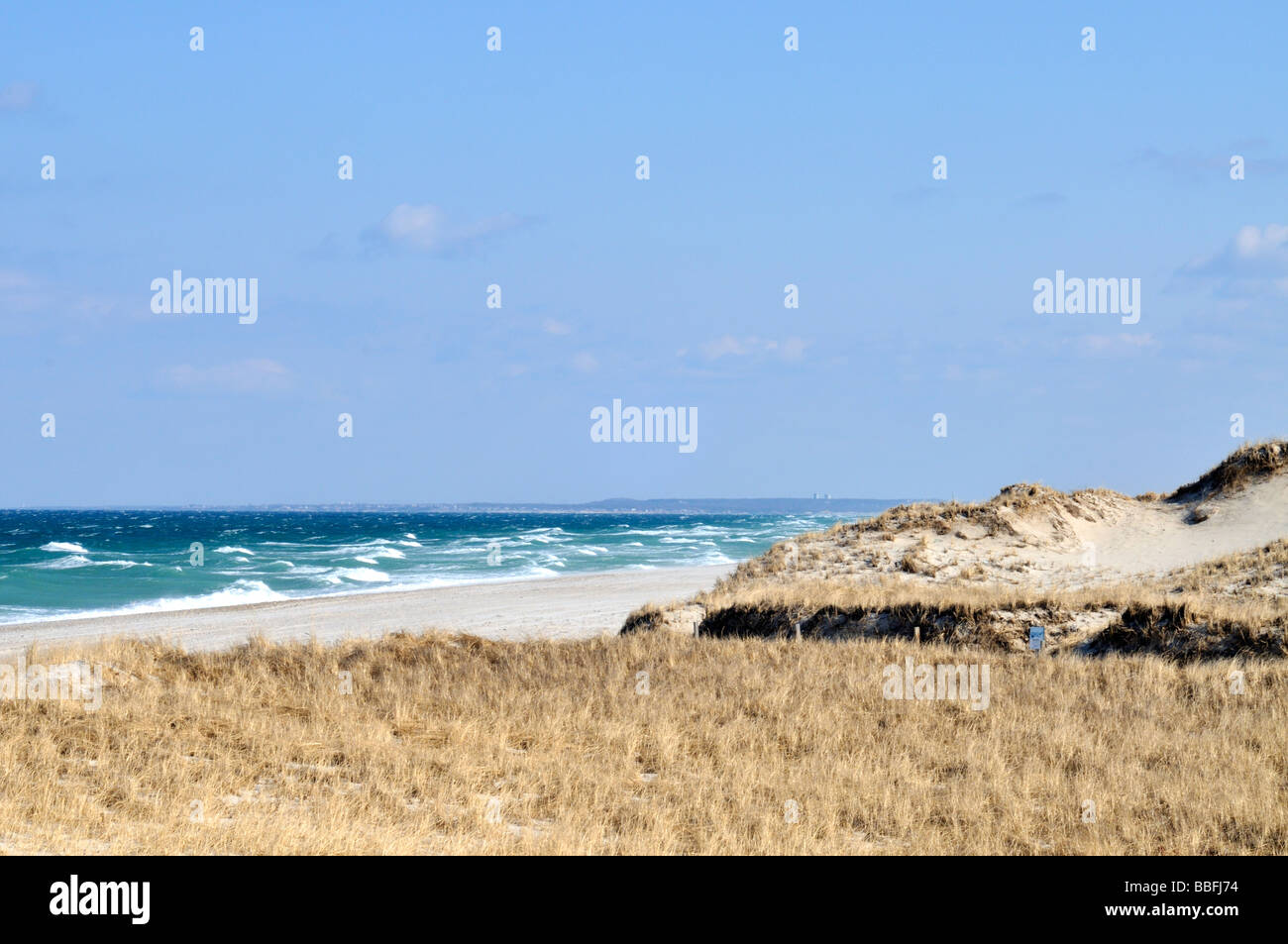 Ocean sand dunes with rough seas and waves at Sandy Neck beach in Sandwich and Barnstable Cape Cod, Massachusetts, USA Stock Photo