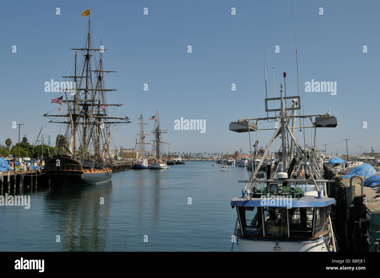 Tall ships and commercial fishing boats Stock Photo - Alamy