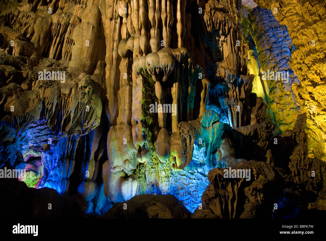 Limestone stalactites and stalagmites in abstract forms inside the reed flute cave, Guilin, China Stock Photo