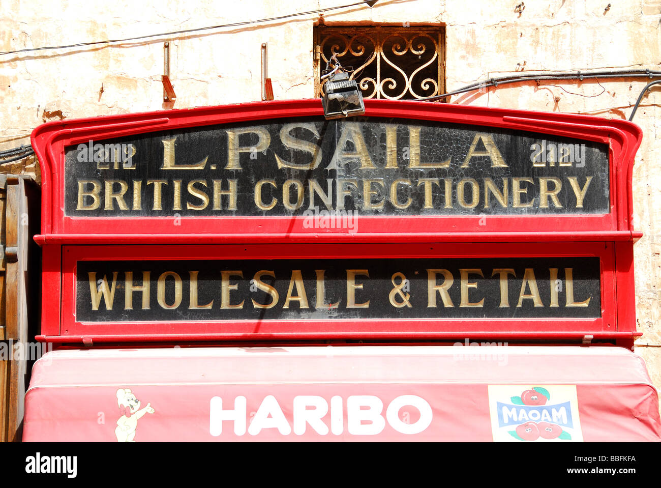 MALTA. Traditional sign for a sweet shop on Merchants' Street in Valletta. 2009. Stock Photo