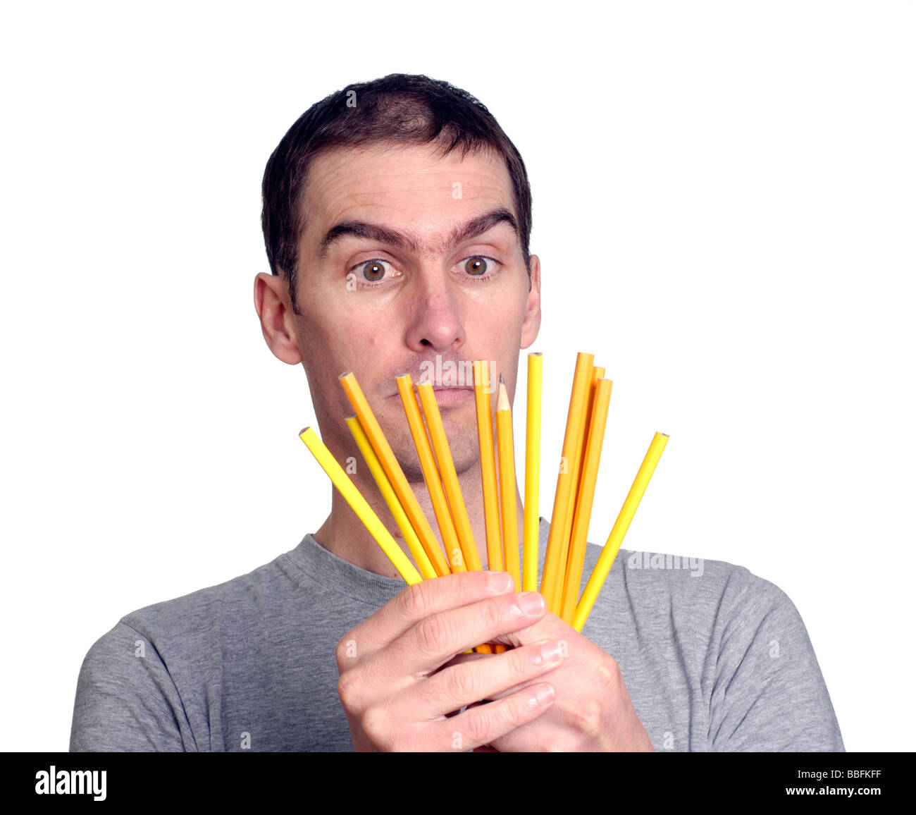 Mature student with pencils Stock Photo