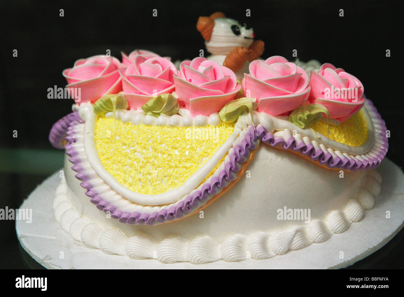 Birthday cake decorated with pink roses Stock Photo - Alamy