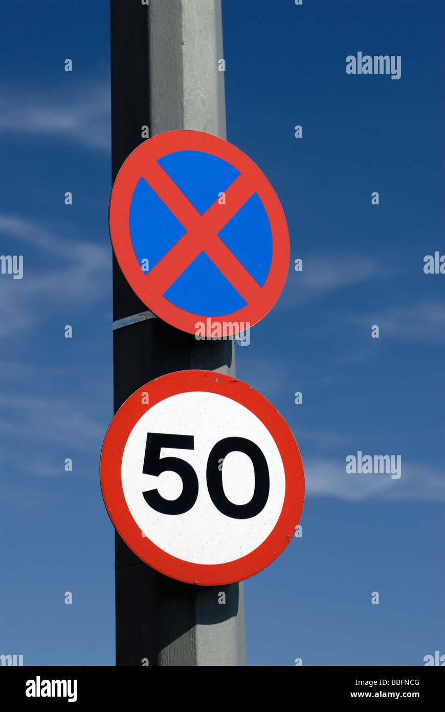 Speed limit sign and 'no stopping sign' clearway Stock Photo