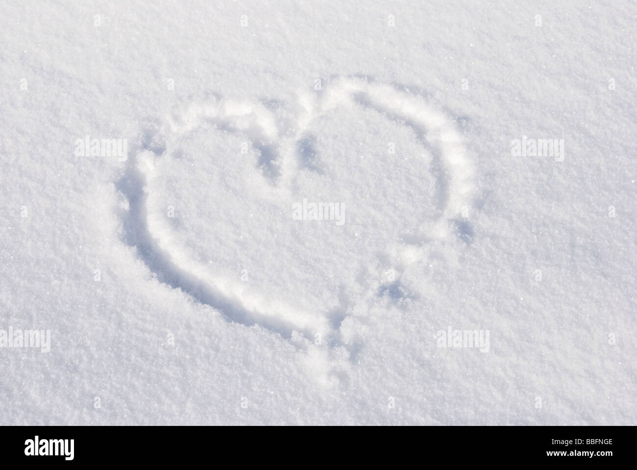 High angle view of a heart shape in snow Stock Photo