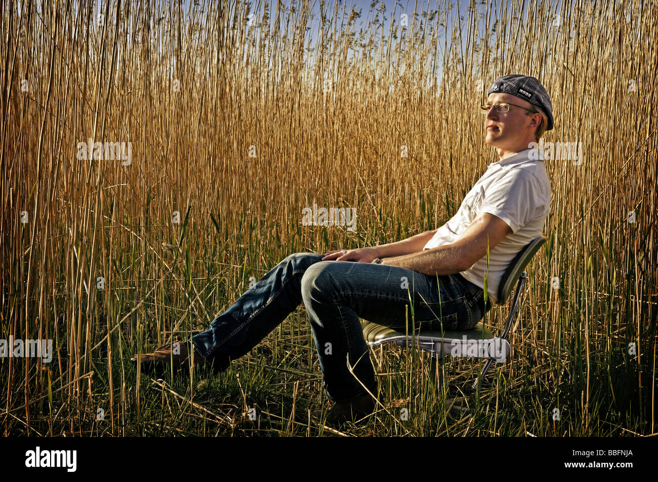 Old man sitting on chair hi-res stock photography and images - Alamy