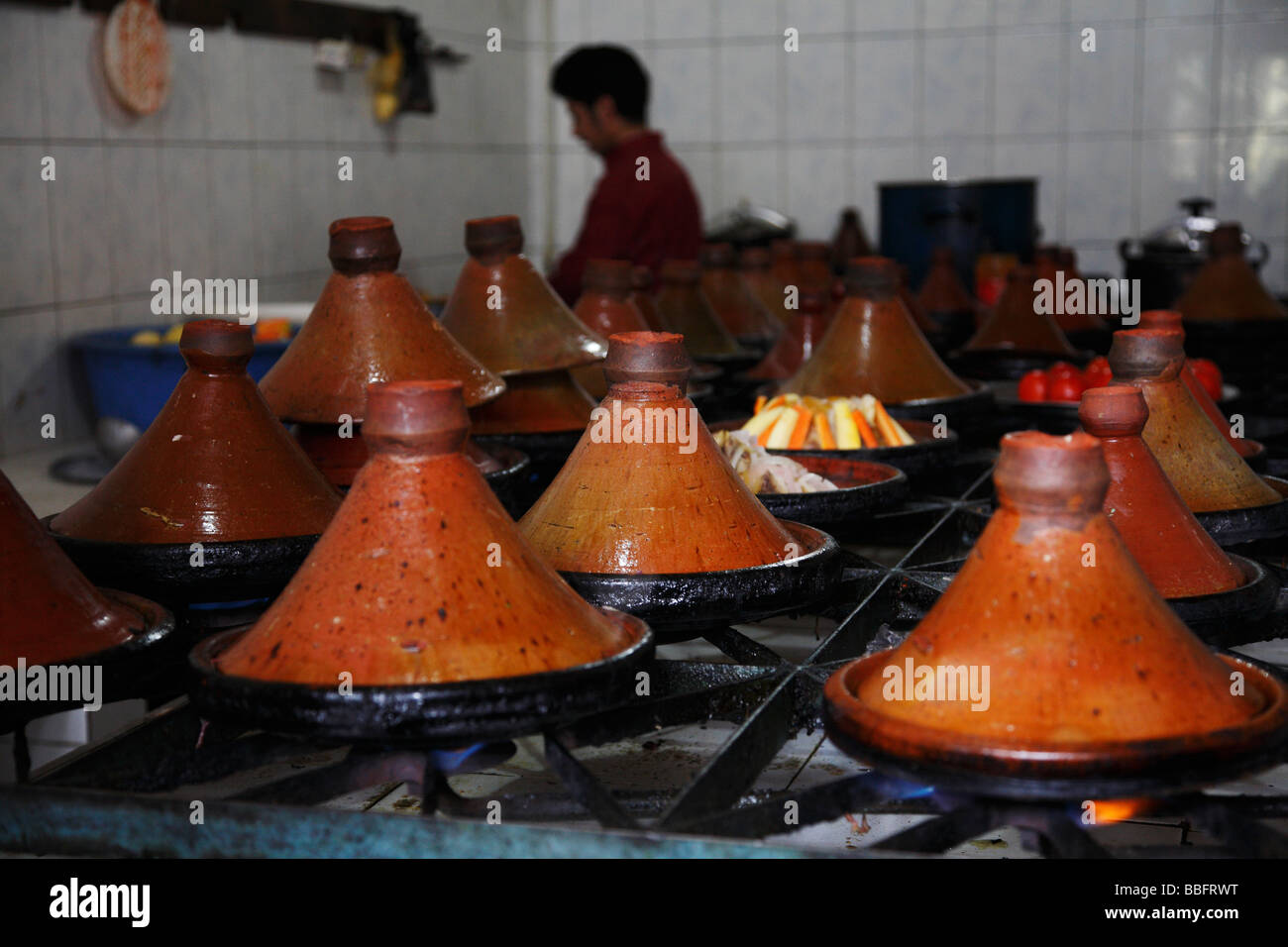 Africa, North Africa, Morocco, Atlas, Mountains, Dades Valley, Boumalne Town, Restaurant, Tajine Pots, Cooking on Gas Stoves Stock Photo