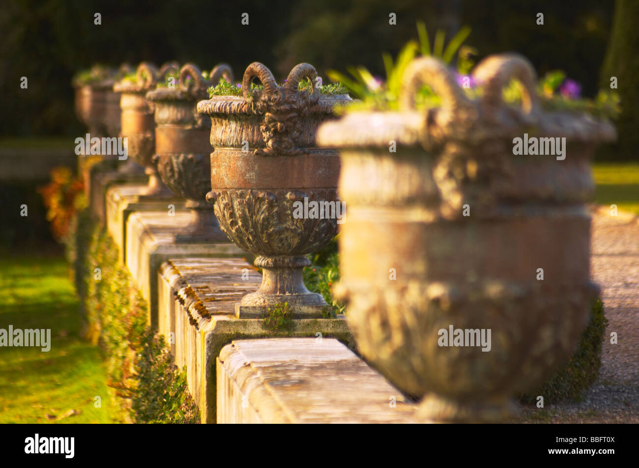Row of ornately designed flower pots in the grounds of Oldway Mansion