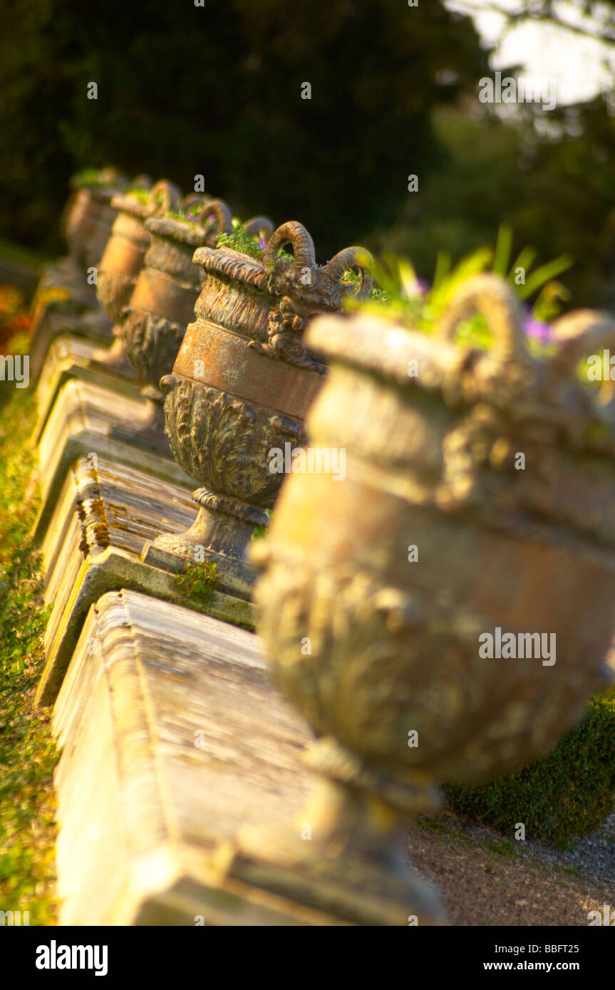 Row of ornately designed flower pots in the grounds of Oldway Mansion