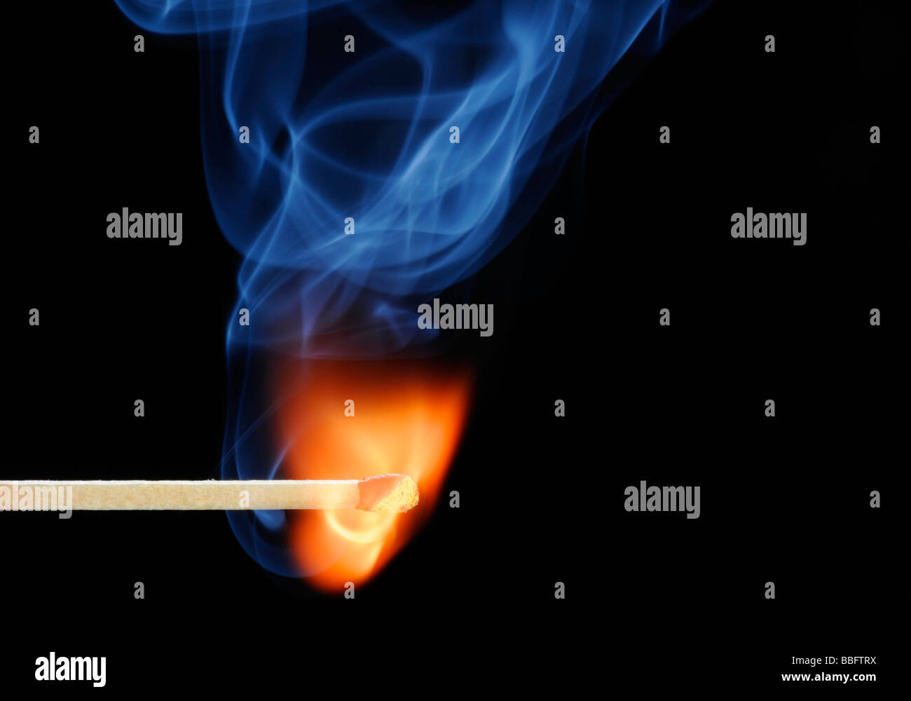 Lit match, flame, blue smoke Stock Photo