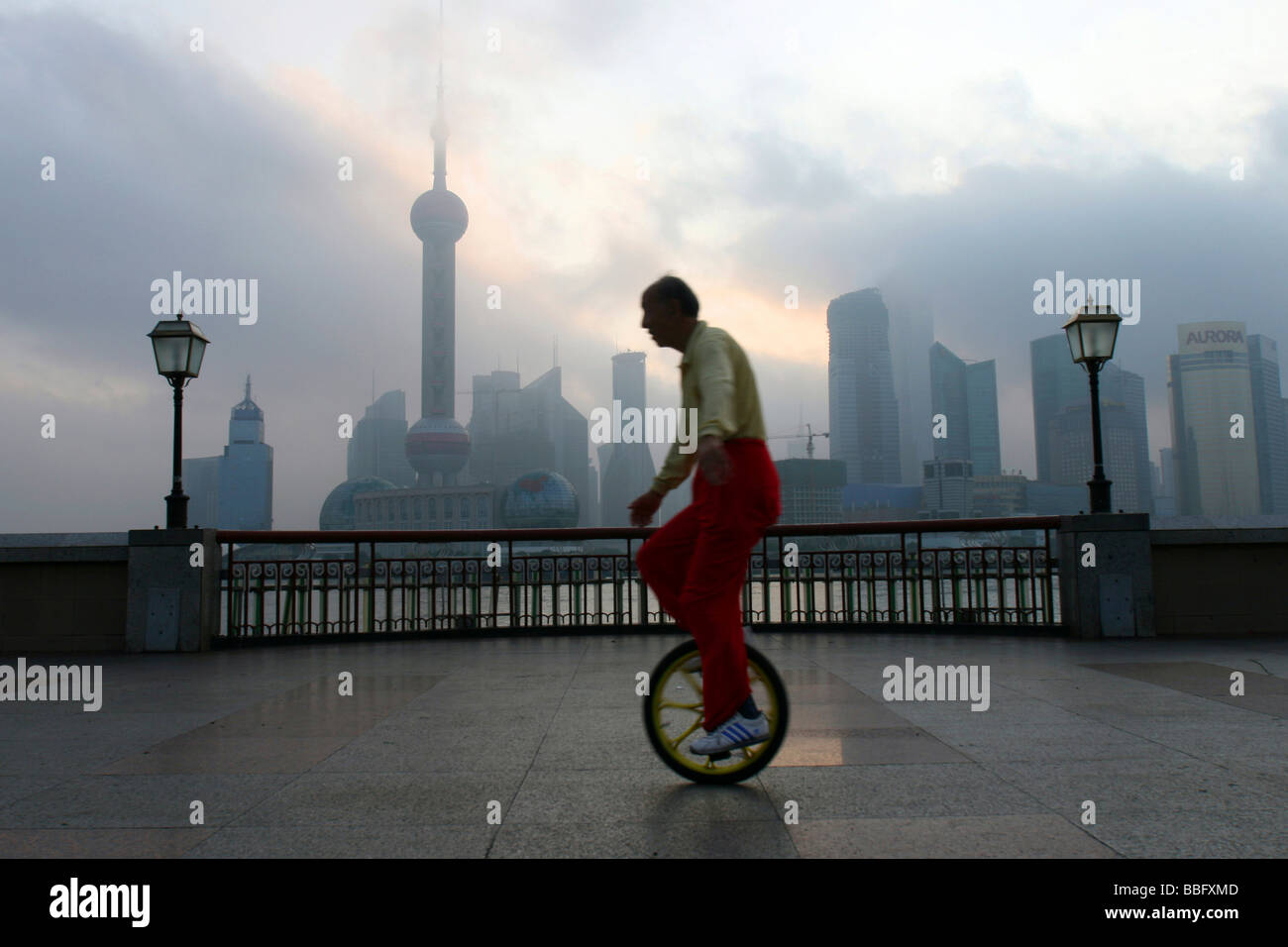 Unicycle rider, Bund in the morning, Shanghai, China, Asia Stock Photo