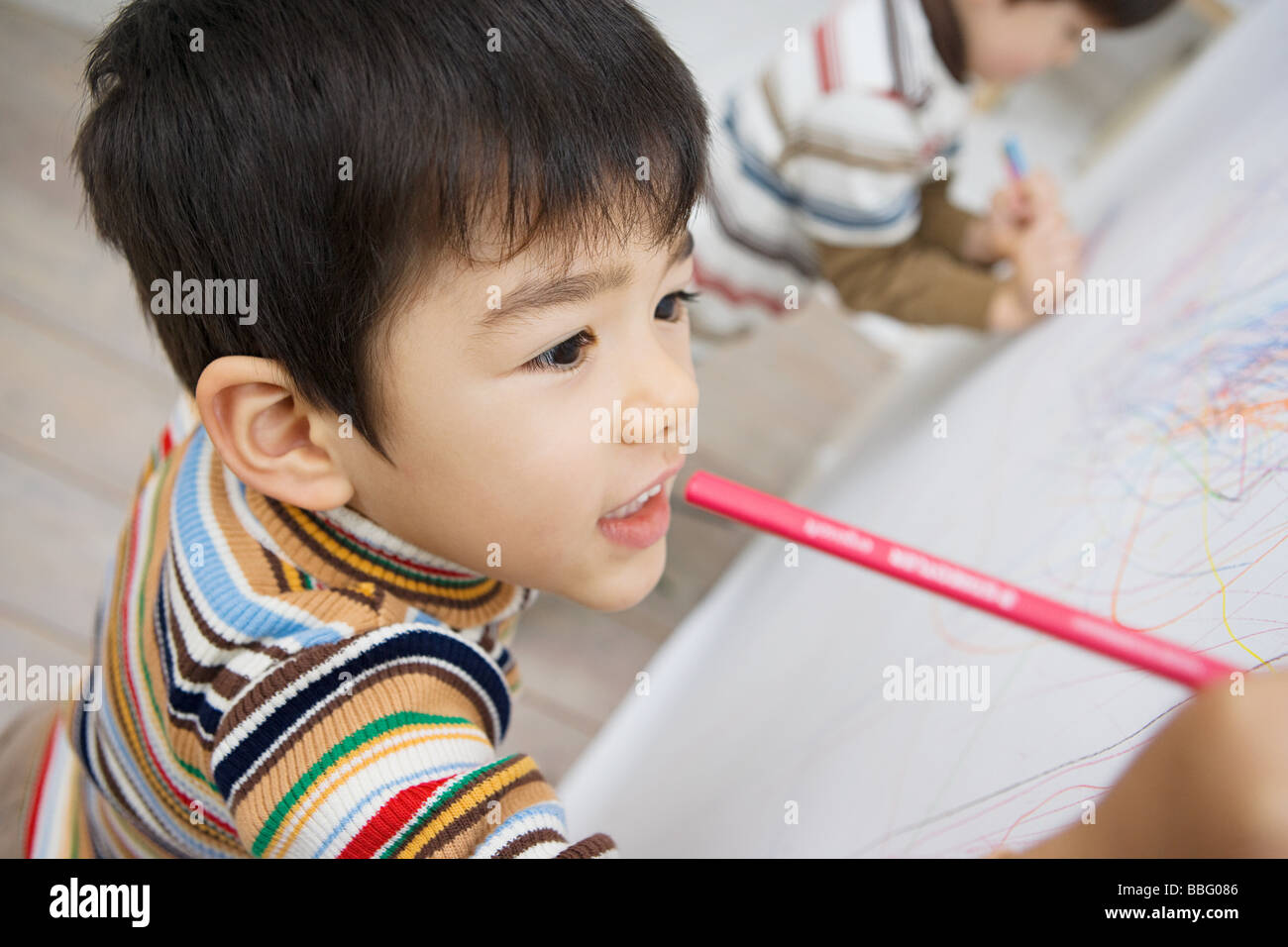 Boys drawing on a wall Stock Photo - Alamy