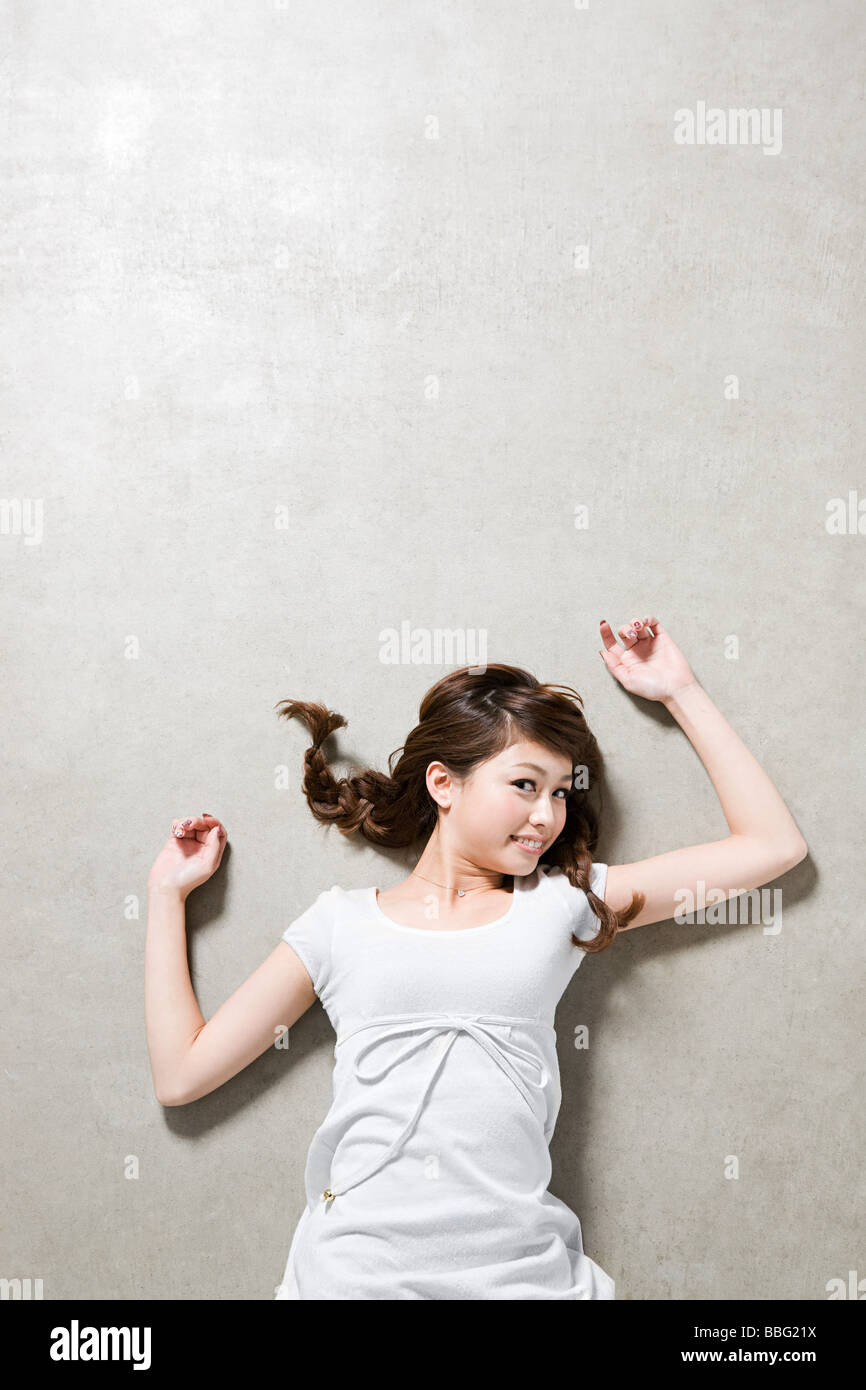 Young woman lying down Stock Photo