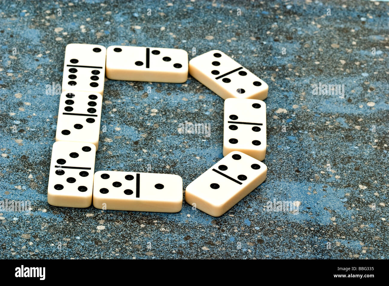 Dominoes forming the letter D. Stock Photo