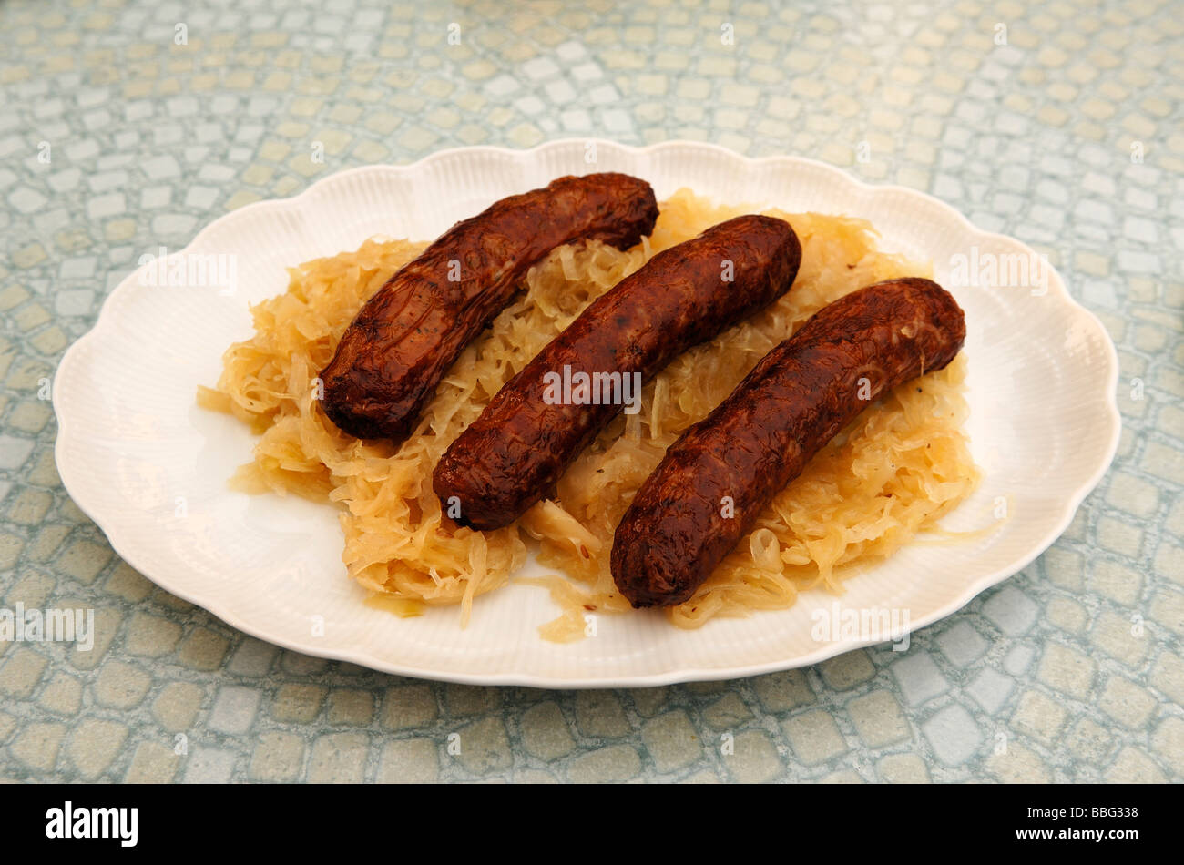 Three Franconian sausages with sauerkraut on a plate, Regensberg, Upper