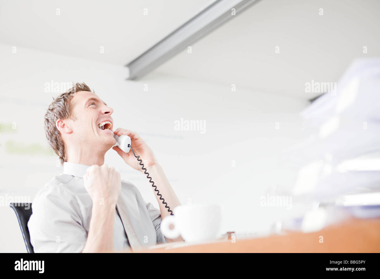 Man enjoying himself on the phone Stock Photo