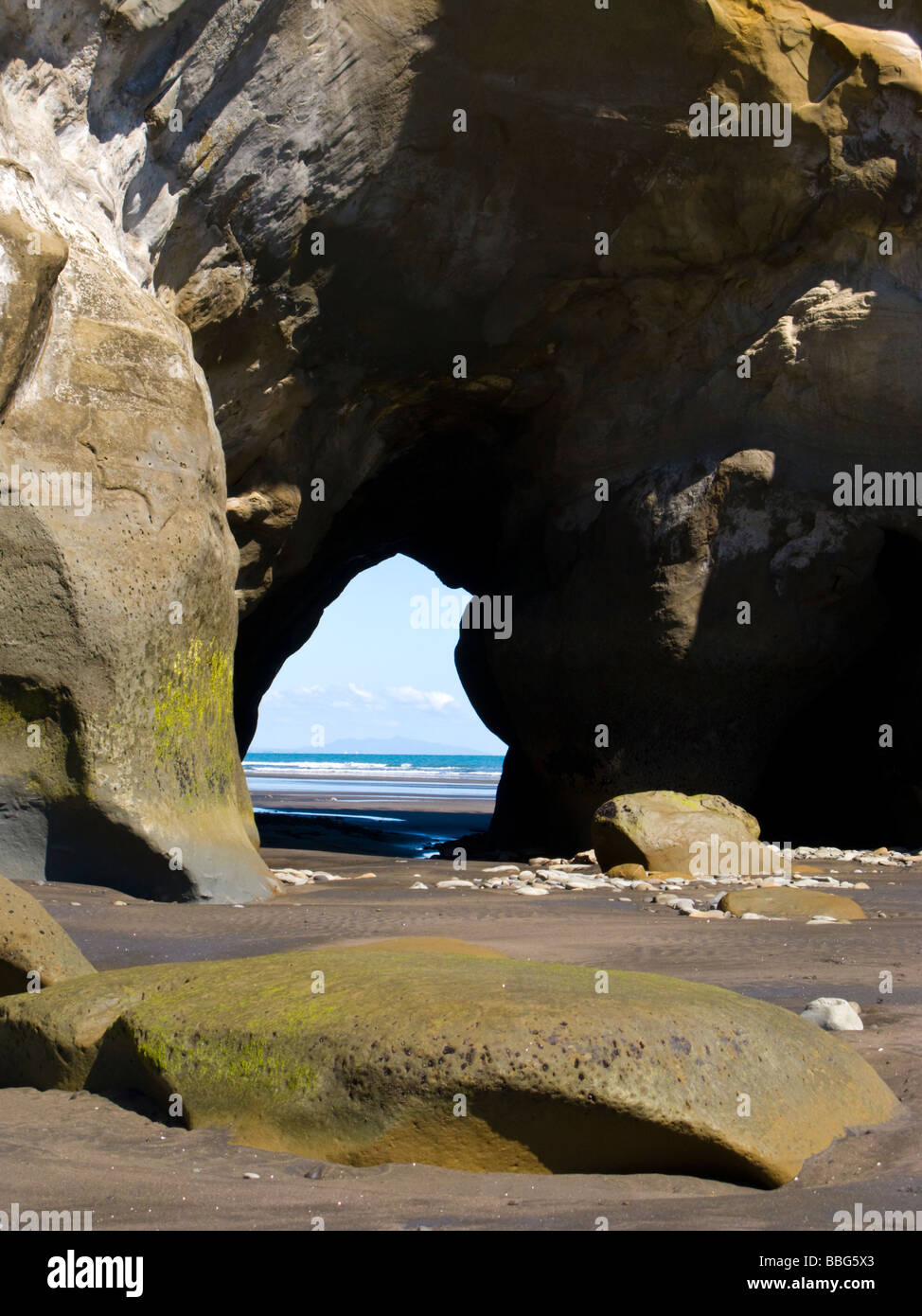 Sea Cave rock arch Three Sisters Beach North Island New Zealand Stock Photo