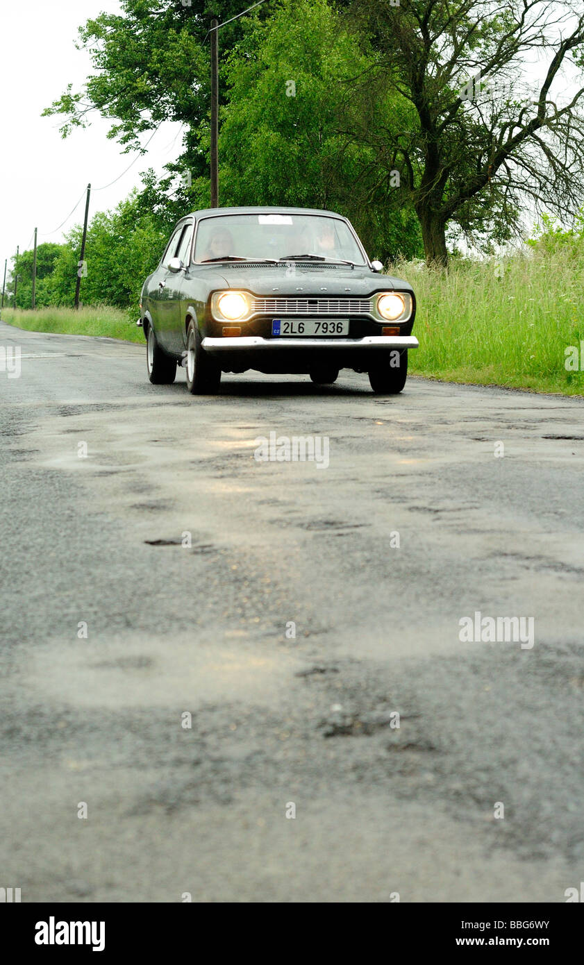 Vintage car on rural road Stock Photo - Alamy
