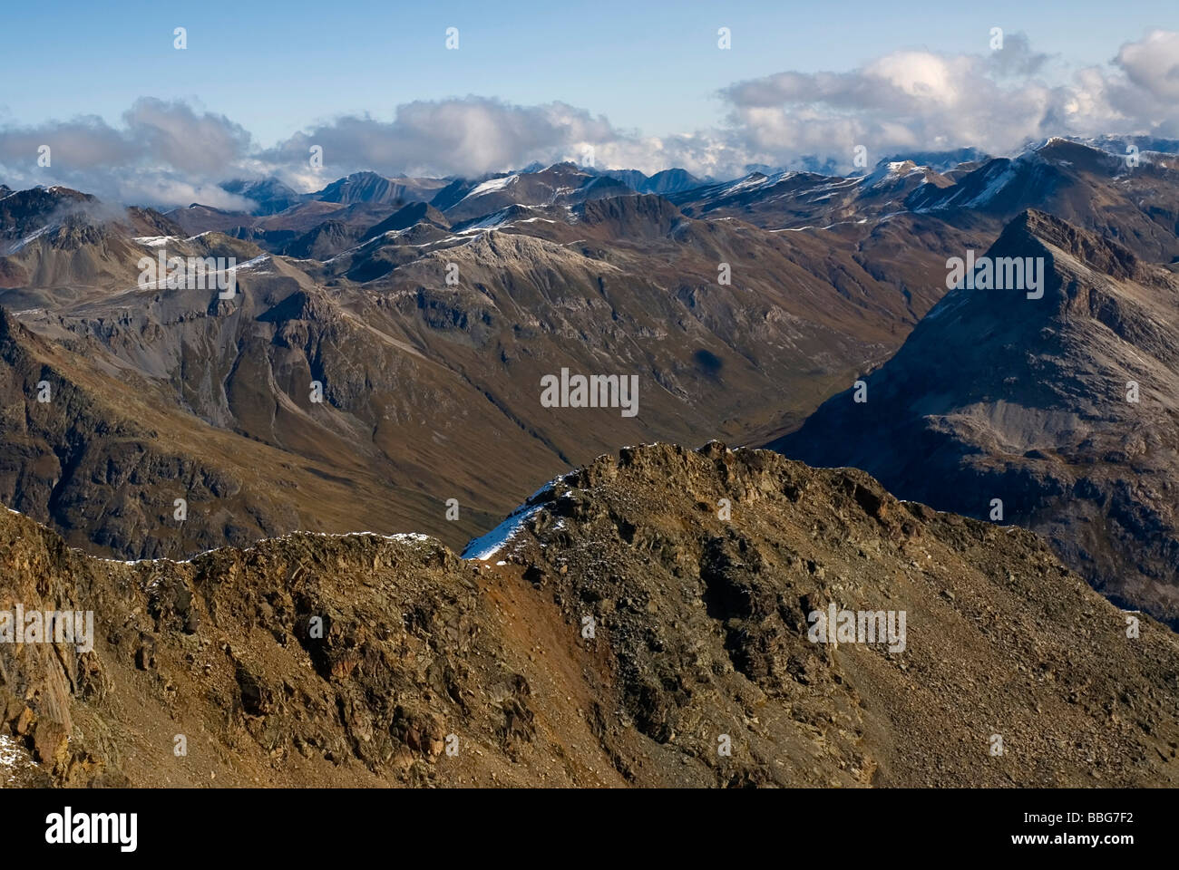 View of the barren mountain peaks and ridges in the Eastern Alps north of the Bernina Pass, Canton Graubuenden or Grisons, Swit Stock Photo