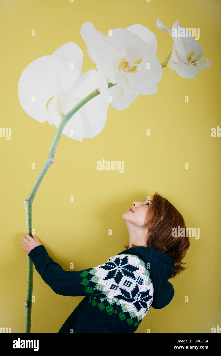 Young girl faces wallpaper with flower Stock Photo