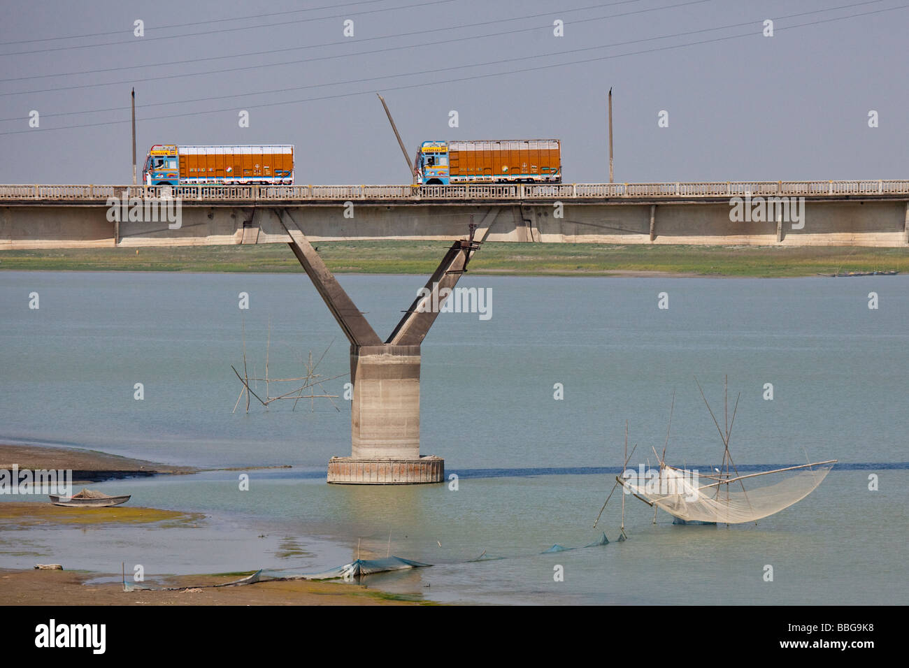 Trucks on a Bridge over a Fishing Net in the River in Rural Bihar