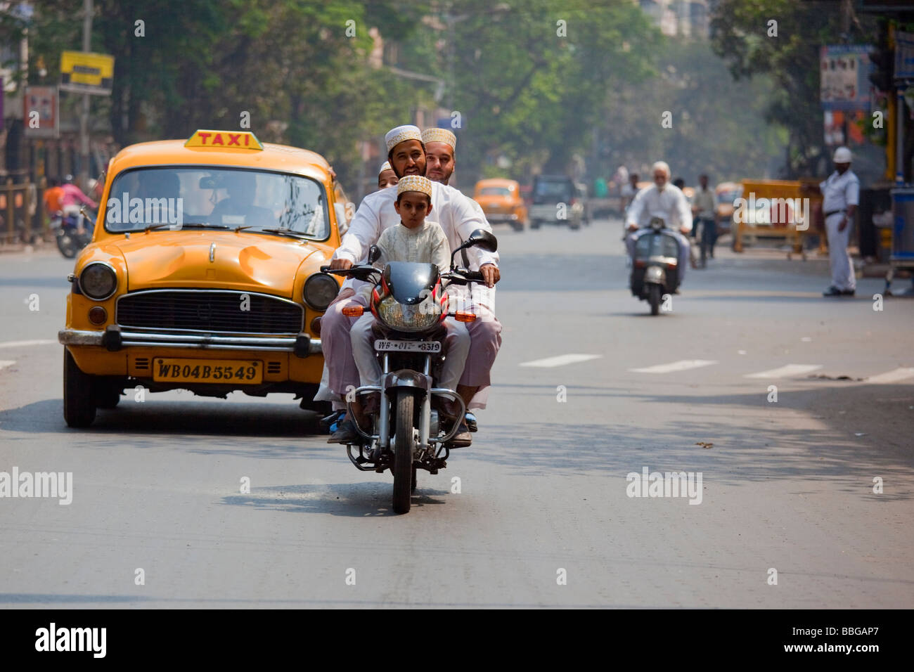 Muslim Men and Boys on a Motorcycle in Calcutta India Stock Photo