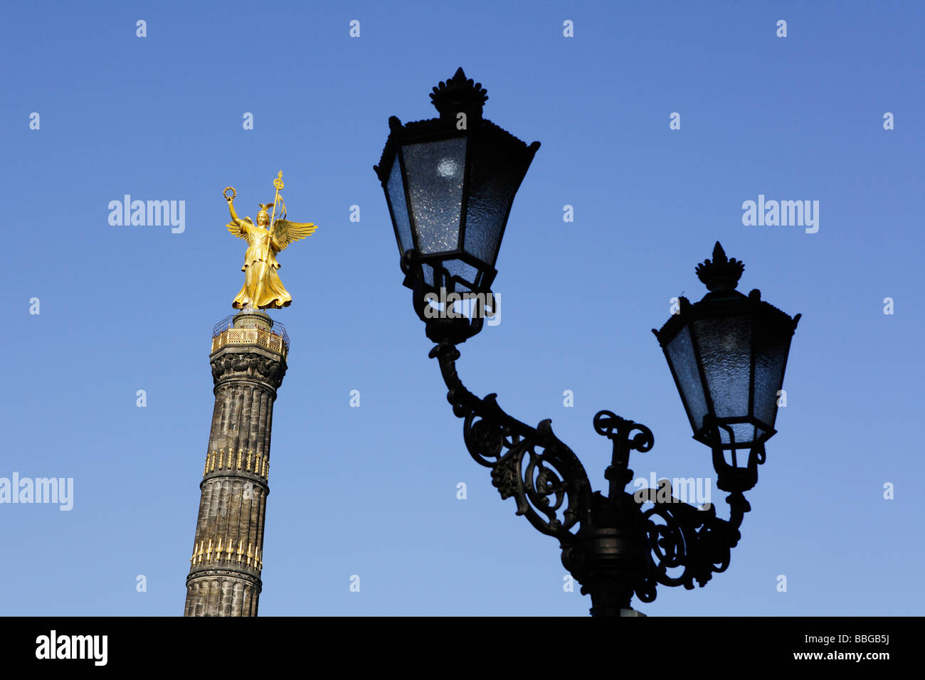 Street lantern and statue of Victoria on the Siegessaeule, Victory Column in Berlin, Germany, Europe Stock Photo