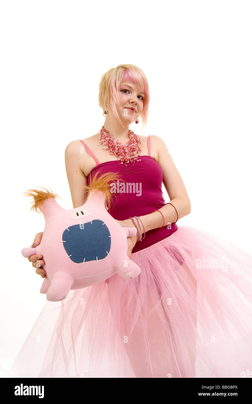 girl with Lucy Monster Factory plush toy Stock Photo