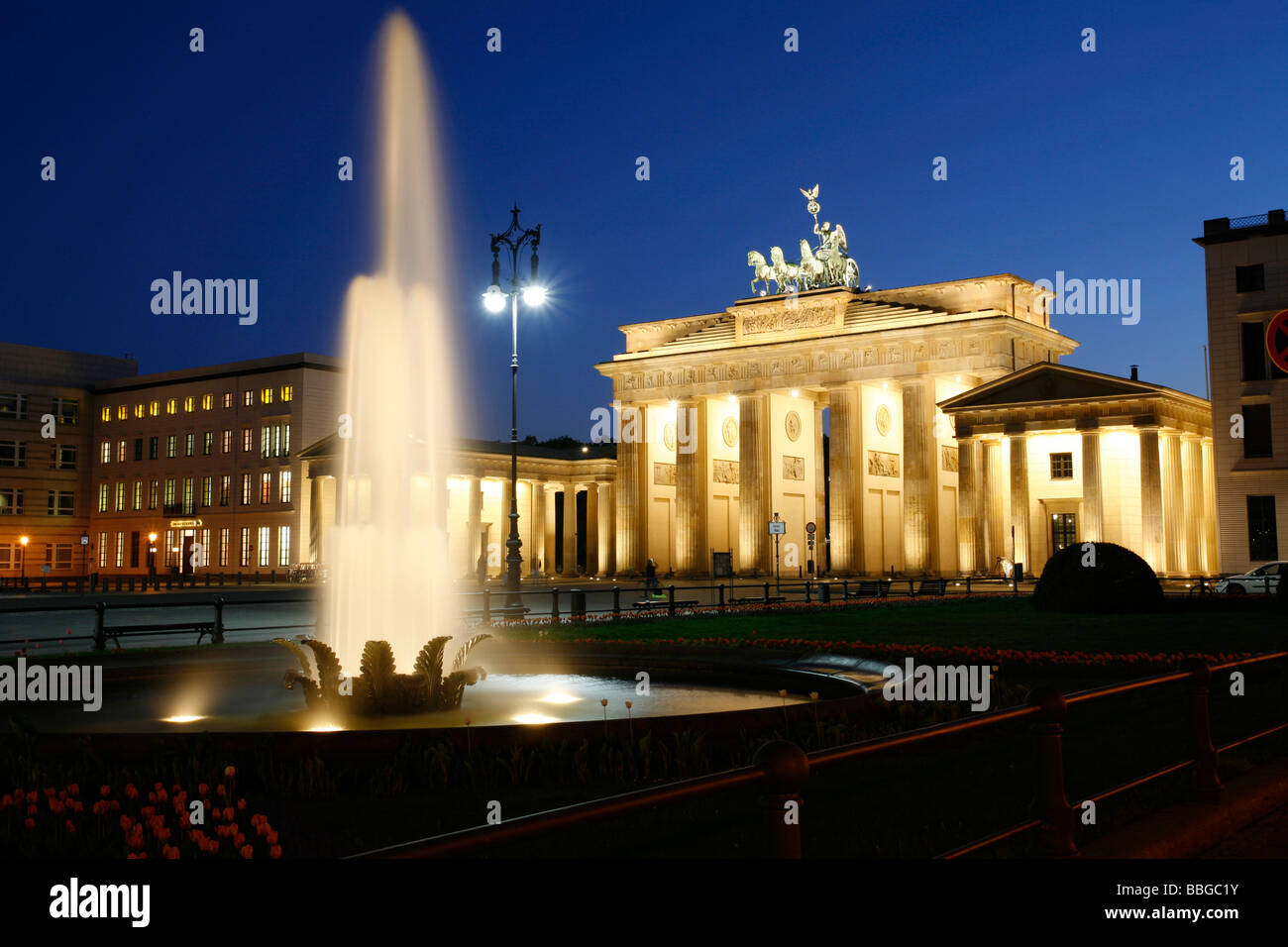 Brandenburg Gate and fountain at the Pariser Platz square at dusk, Berlin, Germany, Europe Stock Photo