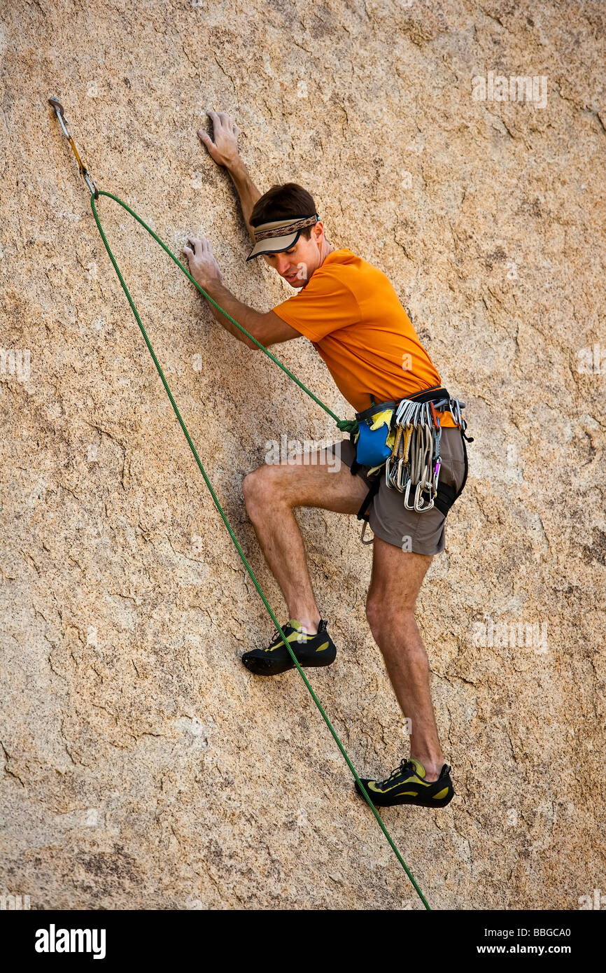 Climber ascends a steep rock overhang Stock Photo Alamy