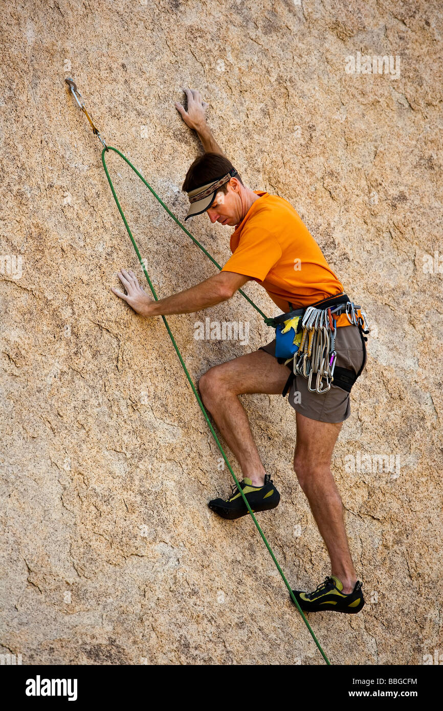 Climber ascends a steep rock overhang Stock Photo Alamy