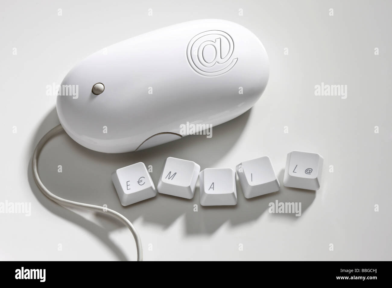 Email lettering on keyboard keys and the @ symbol on computer mouse Stock Photo