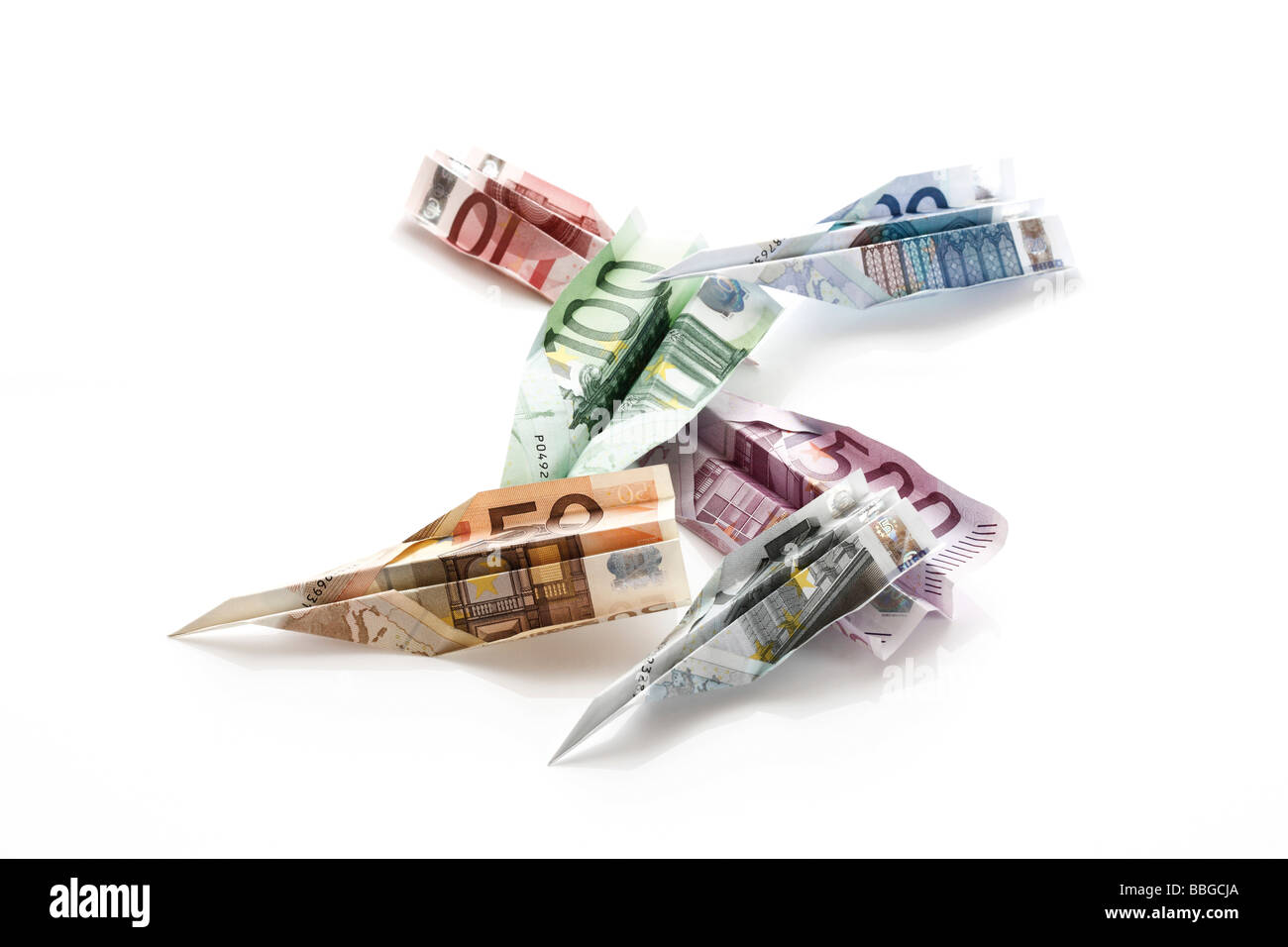 Various euro banknotes, paper planes Stock Photo