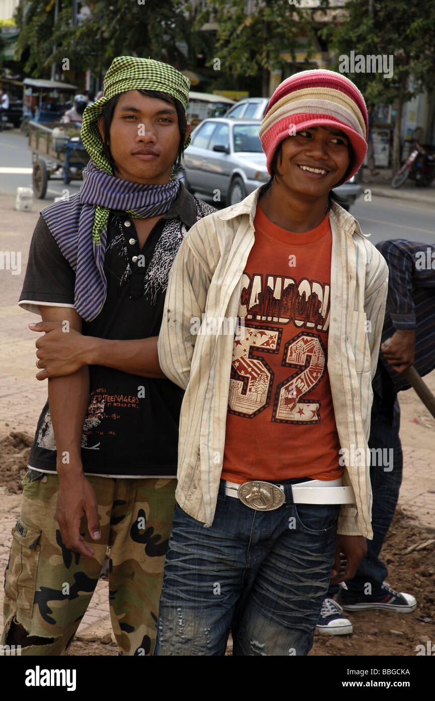 Cambodian workers during a break from digging holes in central Phnom ...