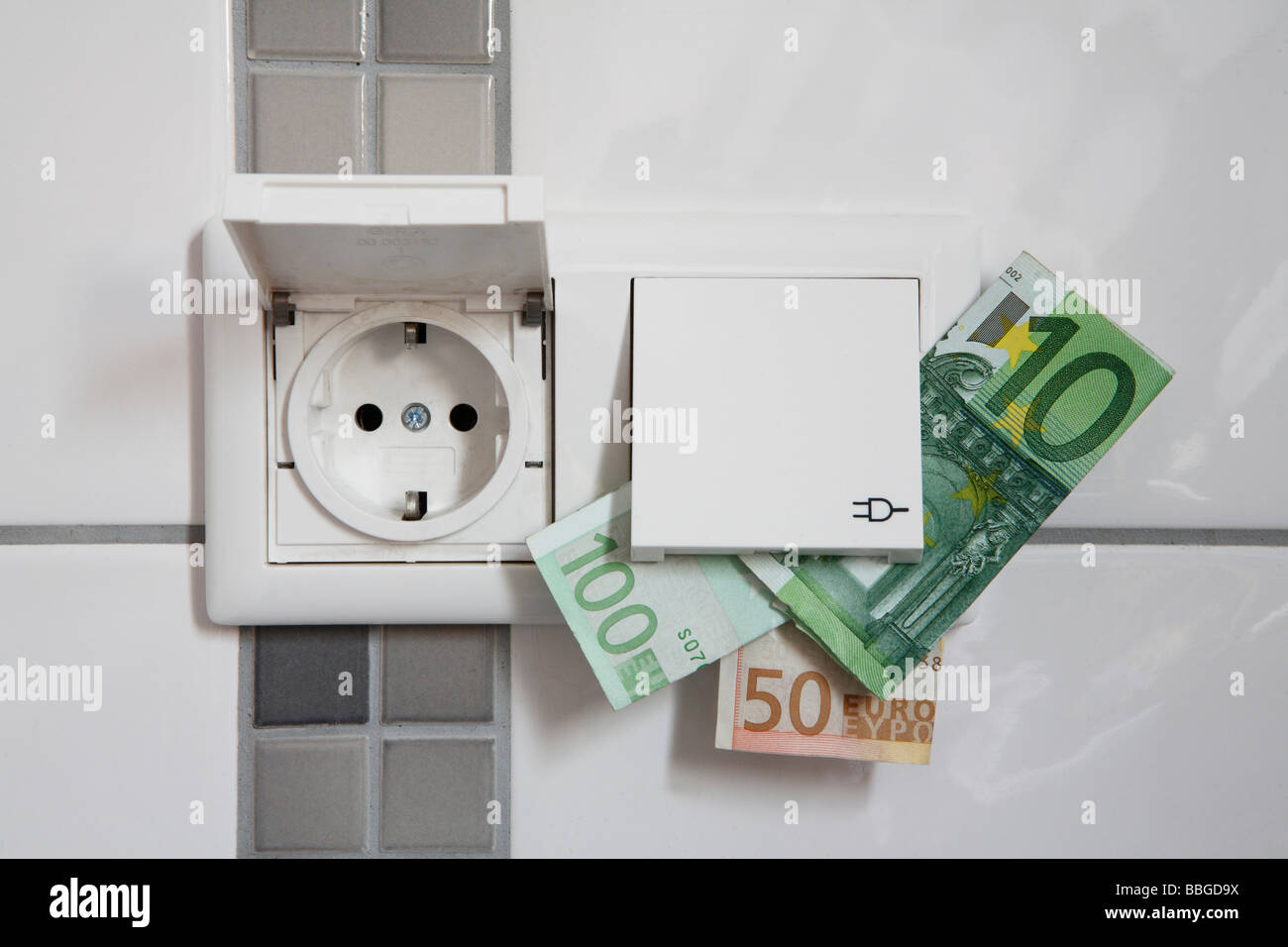 Outlets with protective covers and banknotes Stock Photo