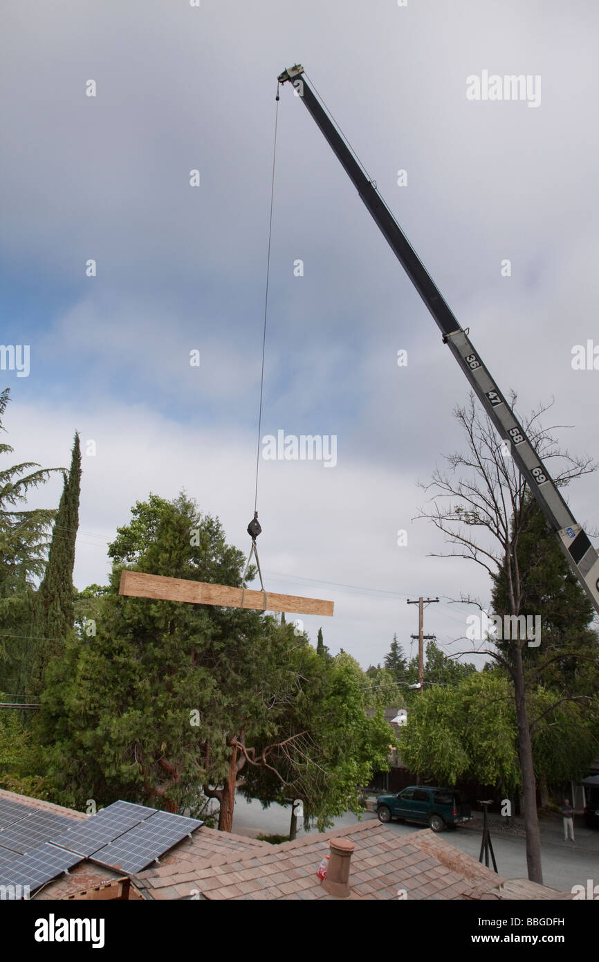 Roof crane lift hires stock photography and images Alamy