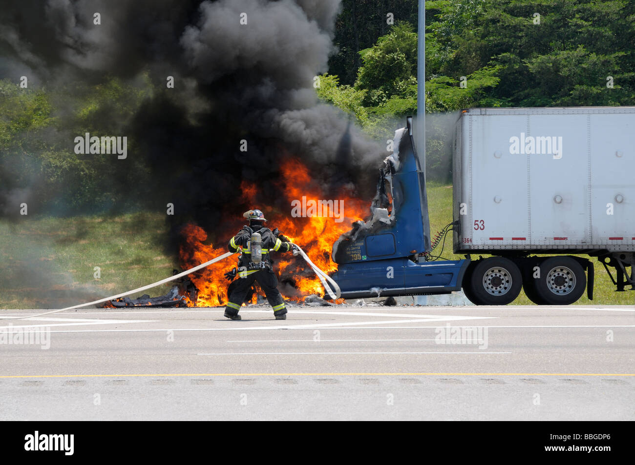 A semi-trailer truck fire consumes the cab of the truck on I-640 in Knoxville, Tennessee, USA.  Photo by Darrell Young. Stock Photo