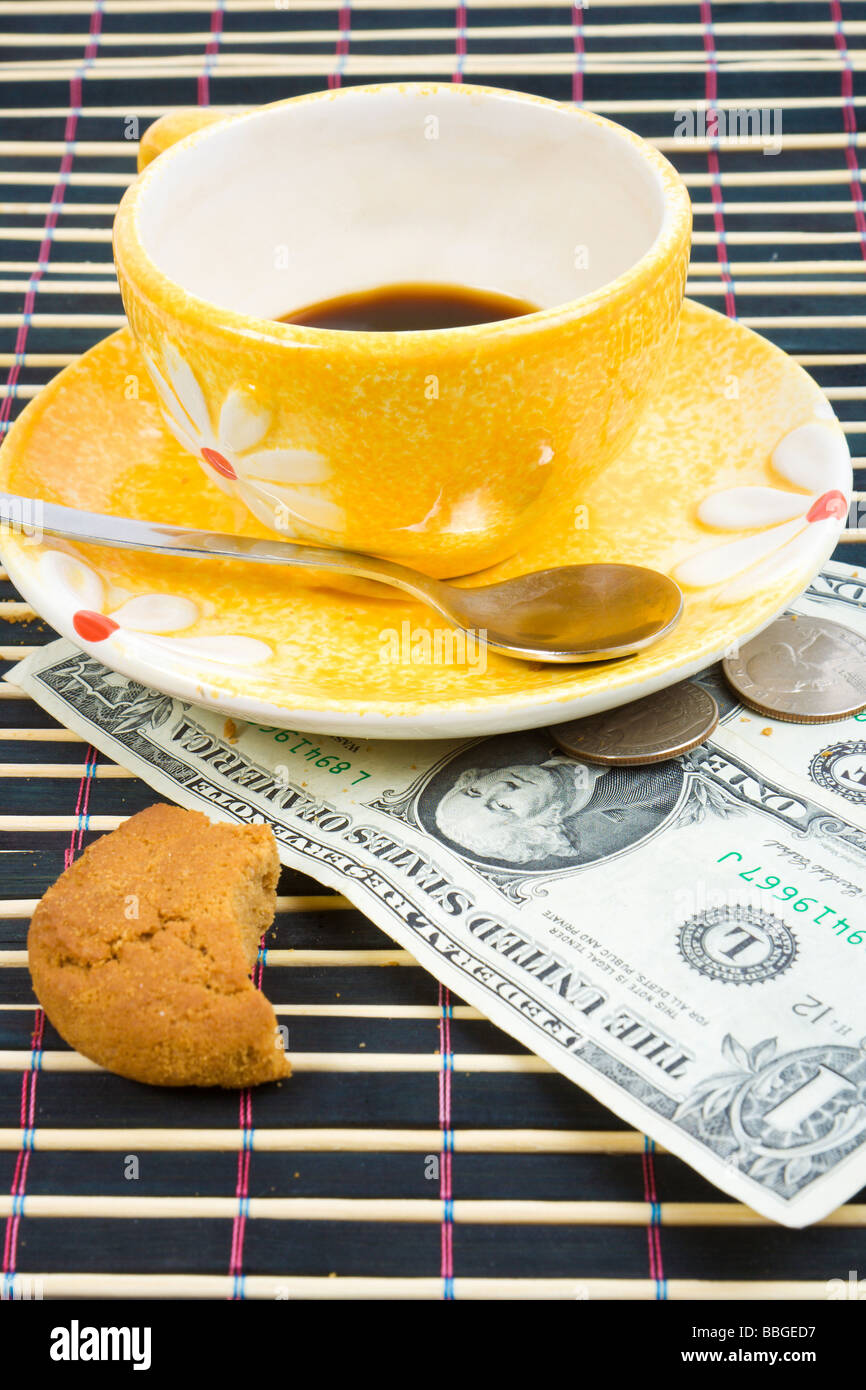 Three dollars and 50 cent pay for coffee and cookies on bamboo table cloth  Stock Photo - Alamy