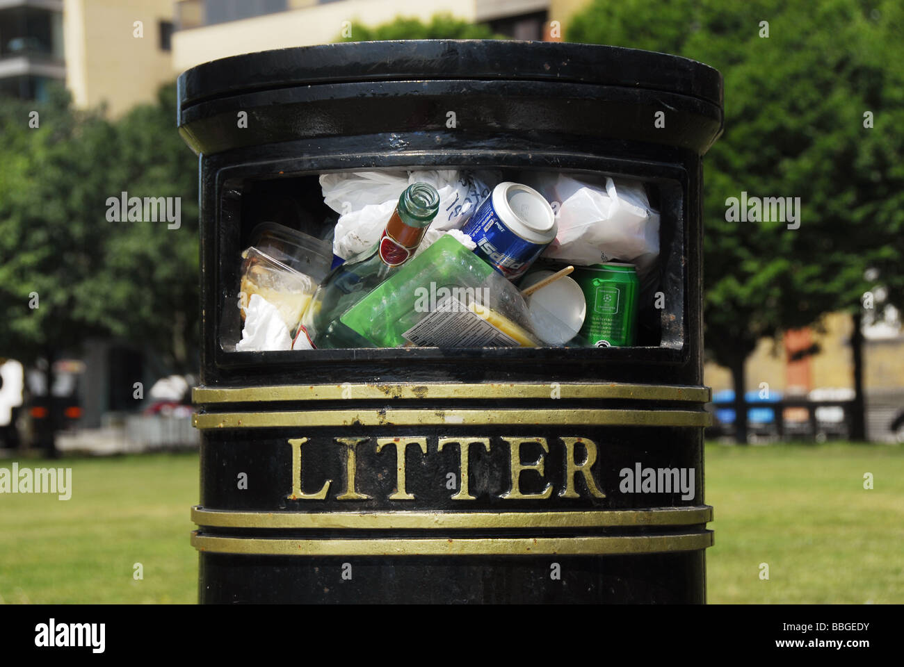 Full litter bin in a London park Stock Photo