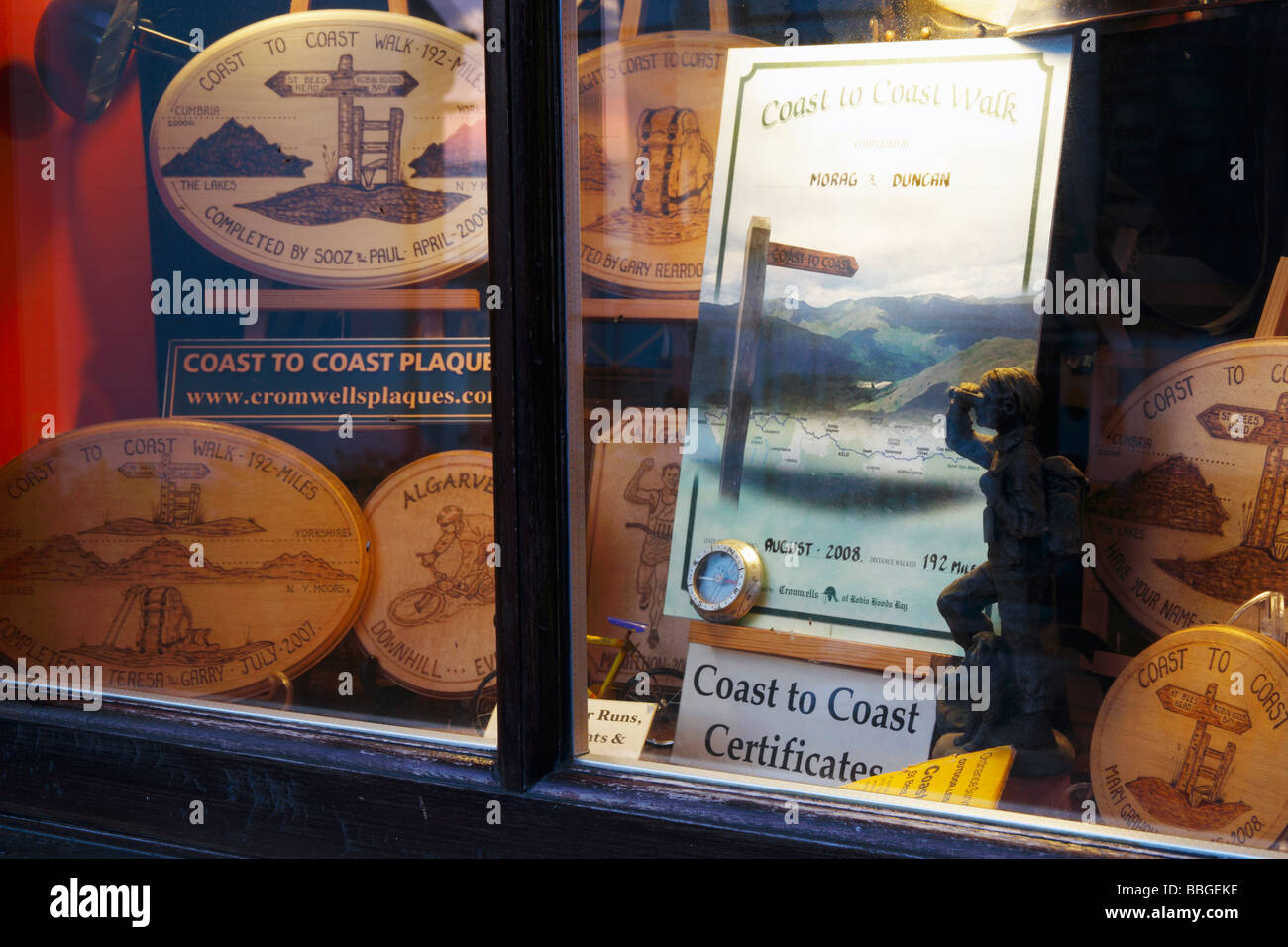 Shop selling coast to coast walk plaques and certificates in Robin Hoods Bay, North Yorkshire, England, UK. Stock Photo