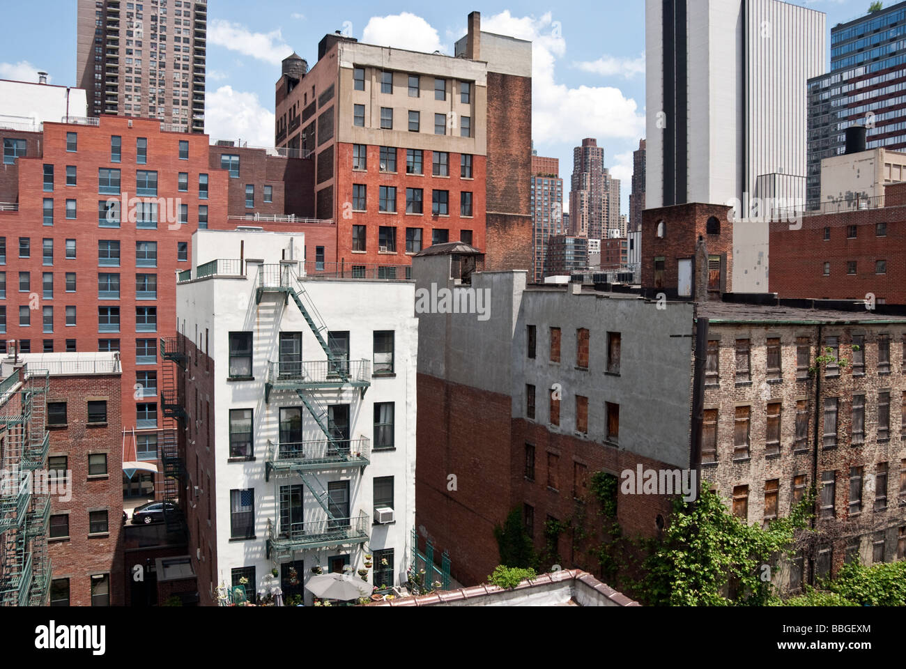 old, new & refurbished buildings seen against the rapidly changing skyline in Hells Kitchen, Manhattan, New York City, USA Stock Photo