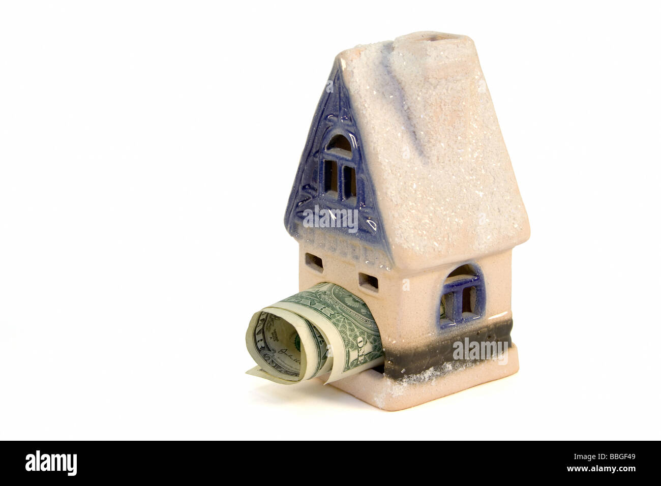 The ceramic house with tree dollars inside Stock Photo