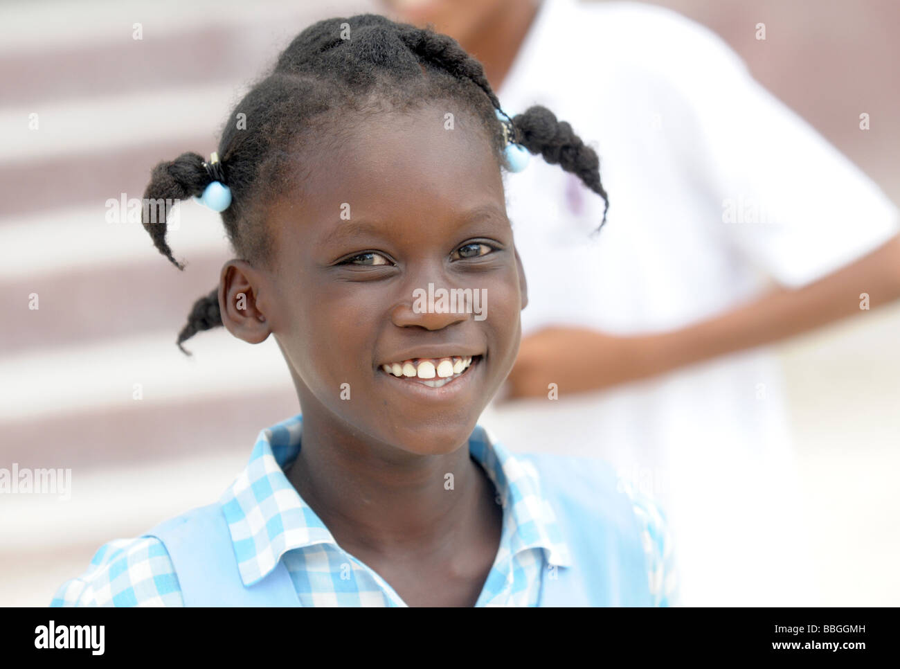 A happy Haitian schoolchild smiling directly at camera Stock Photo