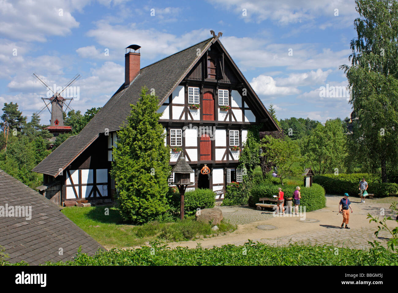 windmill and frame house at mill museum Gifhorn in Northern Germany Stock Photo