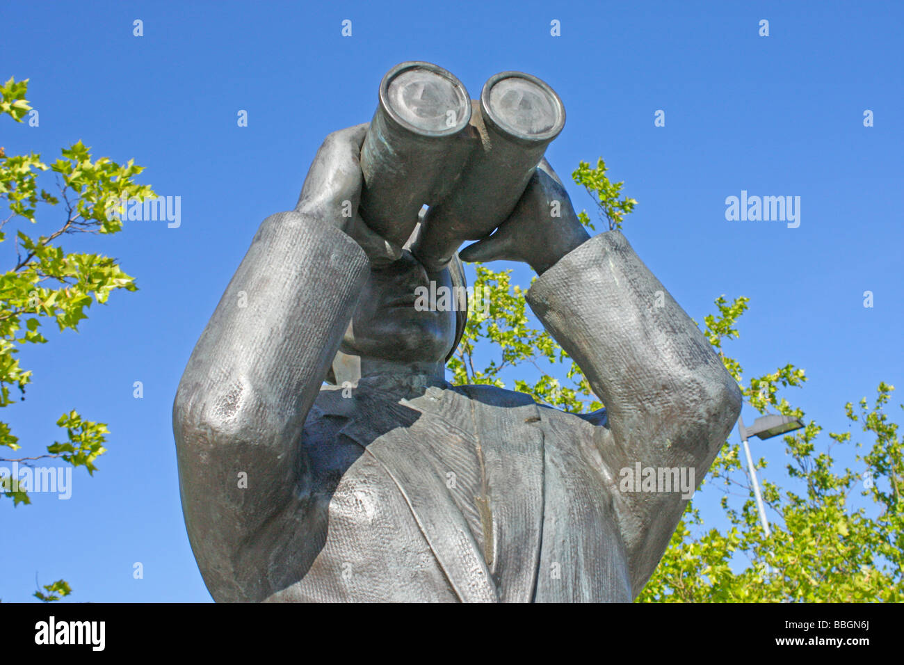 statue of a woman looking through binoculars at the harbour of the small town Vegesack near Bremen in Northern Germany Stock Photo
