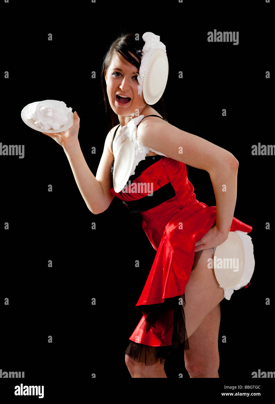 Sexy young brunette woman in a vaudeville style pie fight Stock Photo -  Alamy
