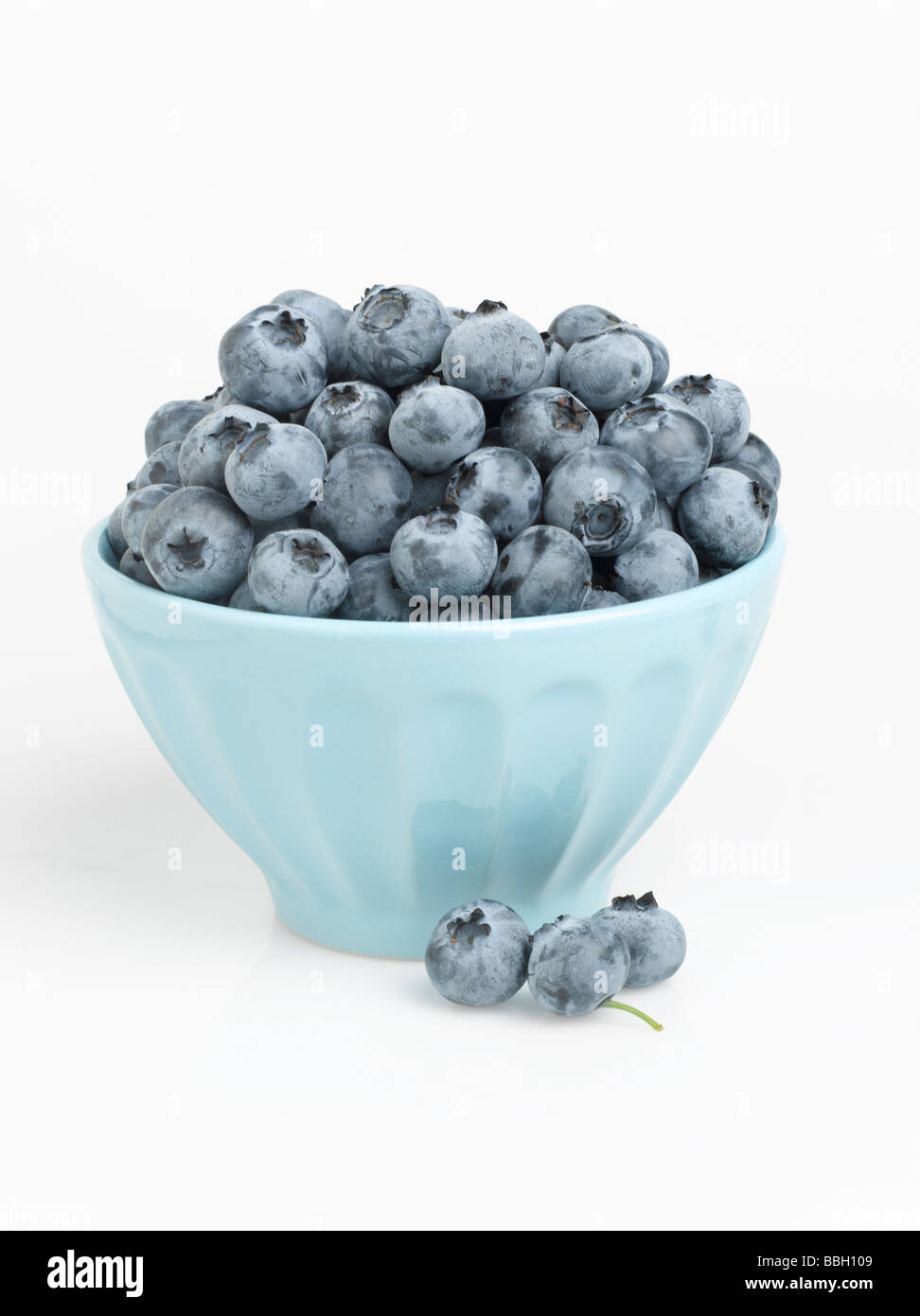 Bowl of blueberries isolated on white background Stock Photo